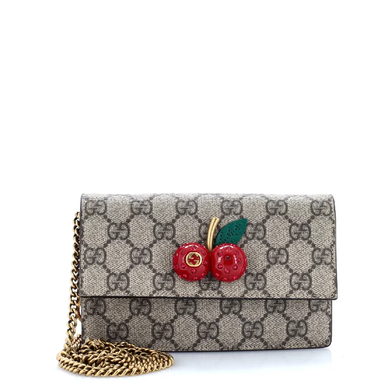 Women Gucci Sylvie bags with a leather - wrapped handleCherries Wallet on Chain GG Coated Canvas Mini