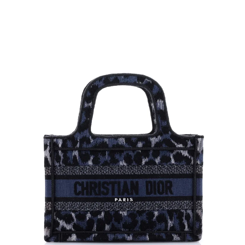 Christian Dior handbags with a snap - button closure and a decorative buckleBook Tote Mizza Embroidered Canvas Mini