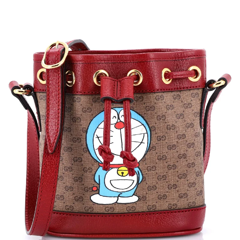 Women Gucci bags with a magnetic snap closure for easy accessDoraemon Bucket Bag Printed Mini GG Coated Canvas Mini