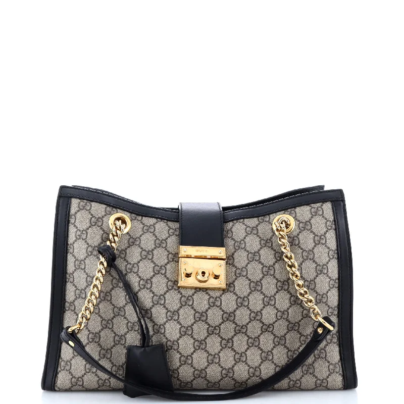 Ladies Gucci Dionysus bags with a chain - link shoulder strapPadlock Chain Tote GG Coated Canvas Medium