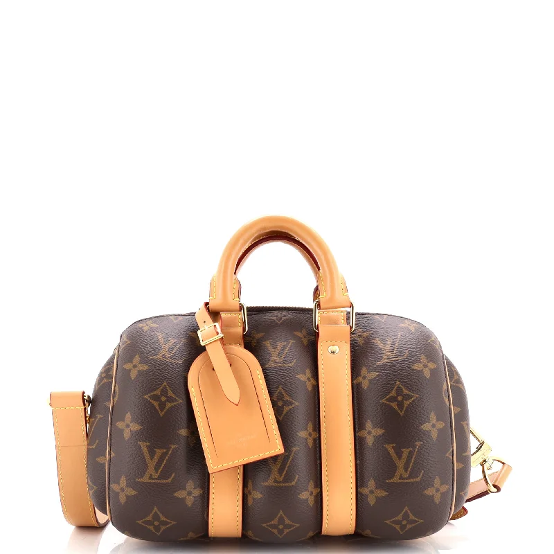 Ladies Louis Vuitton Petite Malle bags with a star - shaped charm for cutenessKeepall Bandouliere Bag Blown Up Monogram Canvas 25