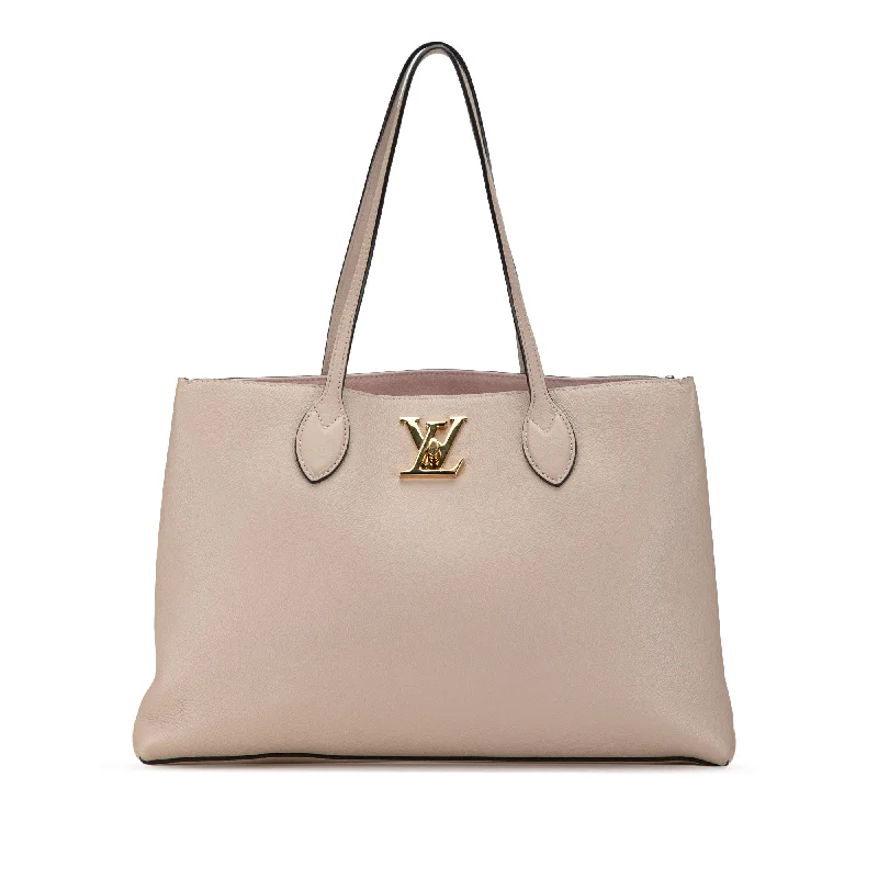 Louis Vuitton bags with a snap - button closure and a decorative charm for stylePink Louis Vuitton Lockme Shopper Tote Bag