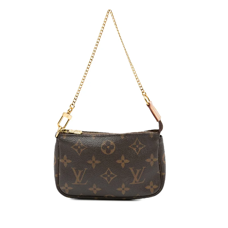 Louis Vuitton Twist bags with a crystal - embellished LV - turnlockBrown Louis Vuitton Monogram Mini Pochette Accessoires Handbag