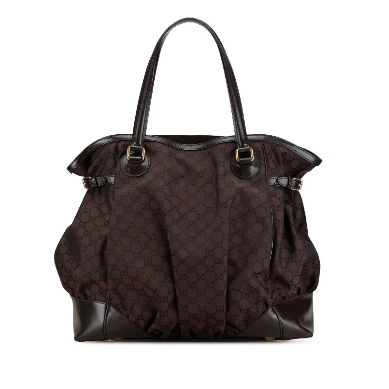 Women Gucci bags with interlocking G hardware for a classic lookBrown Gucci GG Nylon Full Moon Tote