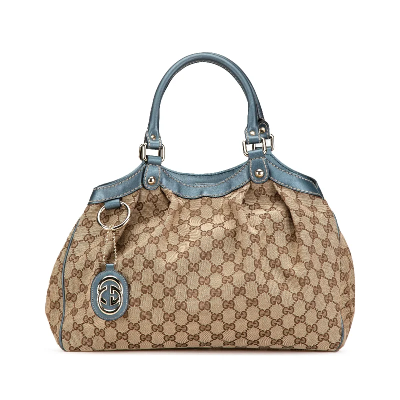 Gucci Marmont bags for women with gold - toned hardwareBrown Gucci GG Canvas Sukey Tote