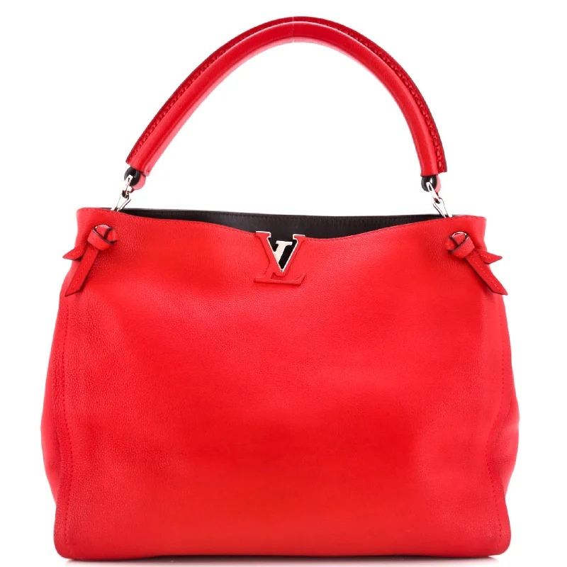 Louis Vuitton handbags with a patent - leather finish for a shiny lookTournon Handbag Leather