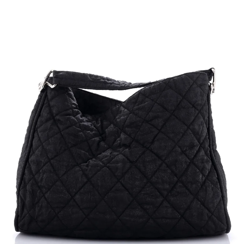 Contemporary Christian Dior handbags with a unique shapeMarais Hobo Quilted Coated Canvas