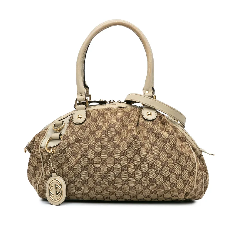 Women Gucci bags with a zippered interior pocketBrown Gucci GG Canvas Sukey Satchel