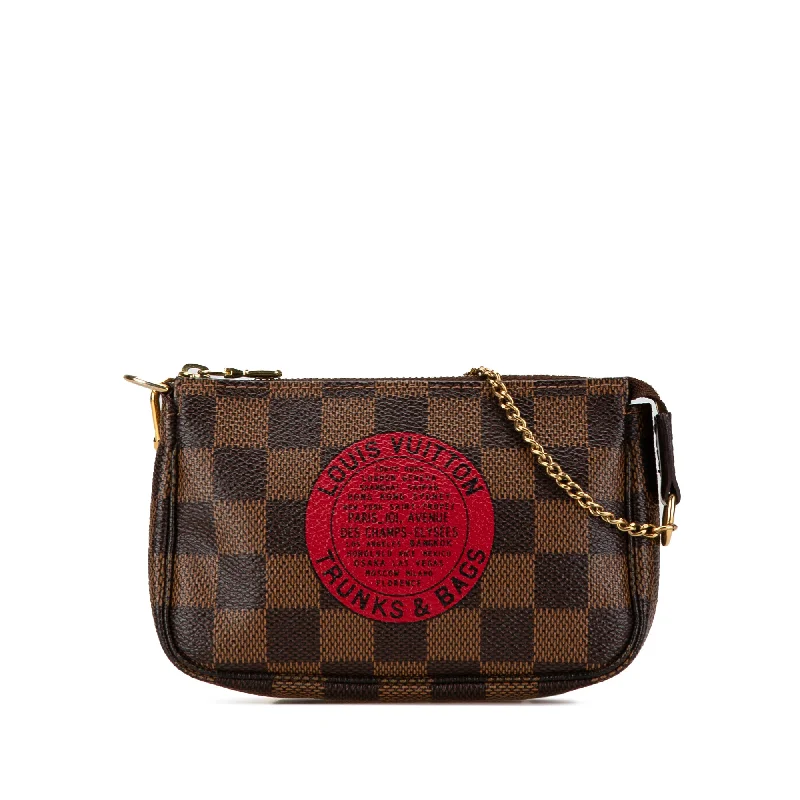 Louis Vuitton Twist bags with the iconic LV - turnlock closureBrown Louis Vuitton Damier Ebene Trunks and Bags Mini Pochette Accessoires