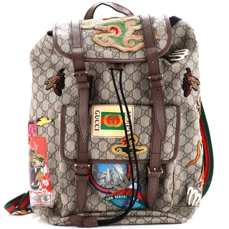 Women Gucci bags with a snap - button closure and a decorative charmCourrier Soft Backpack GG Coated Canvas with Applique Large