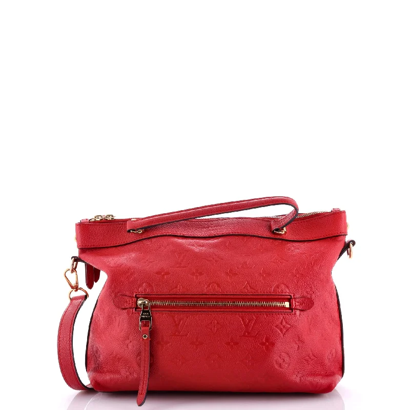 Christian Dior handbags with a snap - button closure and a decorative buckleBastille Bag Monogram Empreinte Leather PM