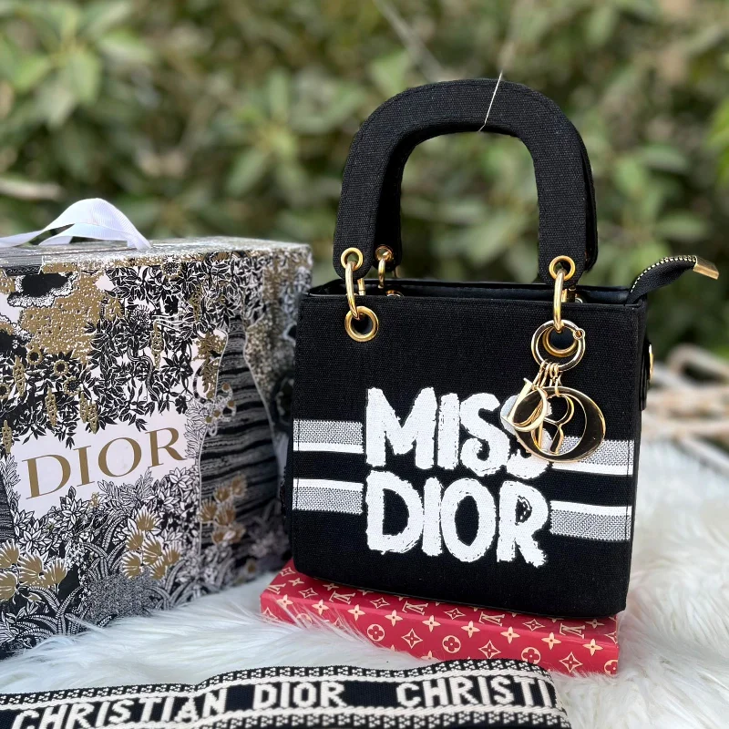 Christian Dior bags with a side - pocket for holding a water bottleMISS DIOR Hand bag  Brand tag  Brand keychain  Brand belt Brand dustbag  (black)