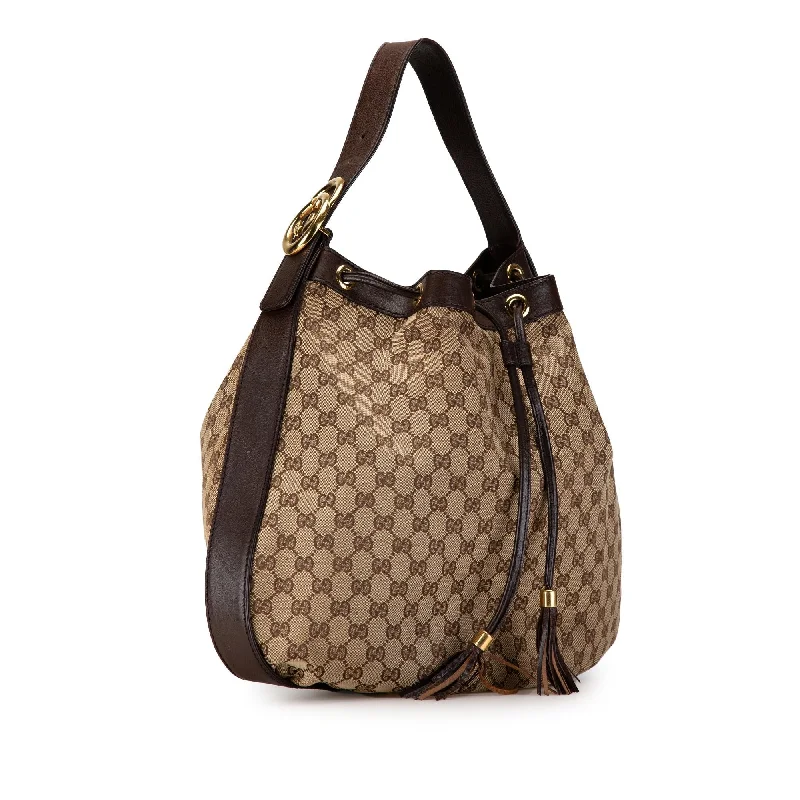 Women Gucci backpacks with a luxurious leather finishGucci GG Canvas Interlocking Icon Drawstring Hobo lDQuIe)