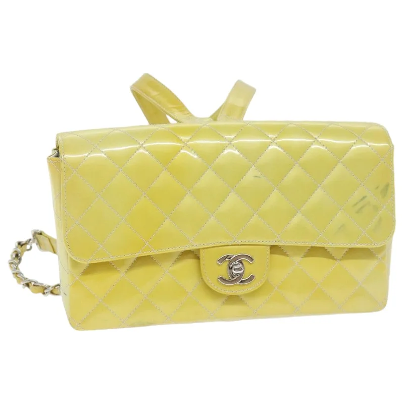 Chanel bags with intricate metal hardwareCHANEL Matelasse Backpack Patent leather Yellow Silver CC  89374